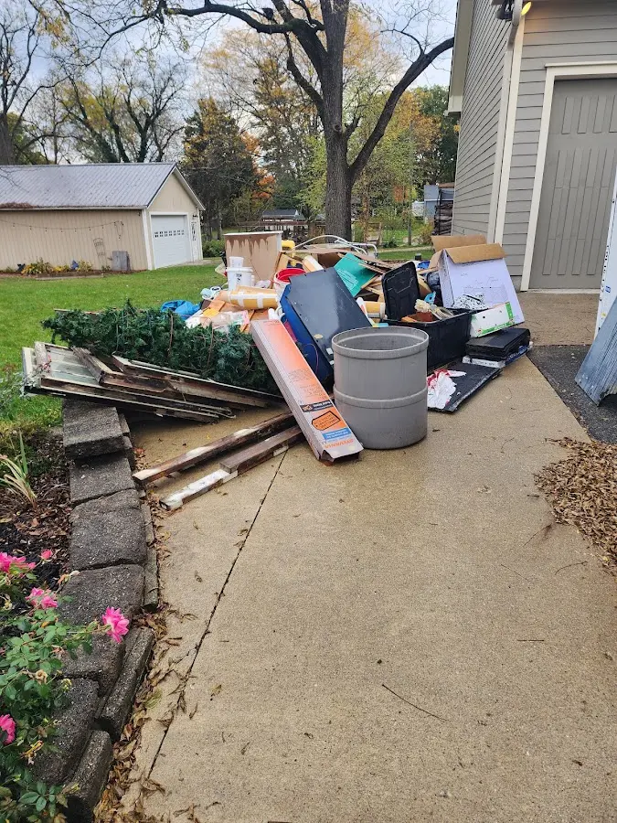 Dumpster being loaded with debris for 3 Yard Dumpster Rental in Barton